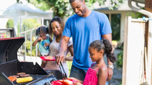 Family grilling outside